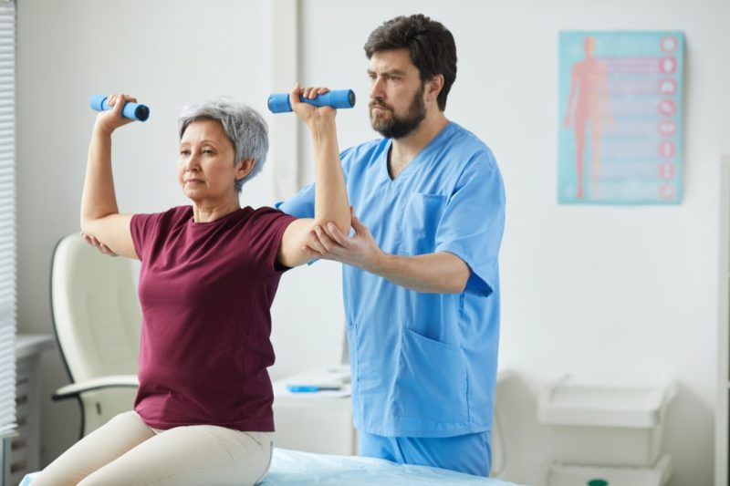 Senior woman exercising at hospital